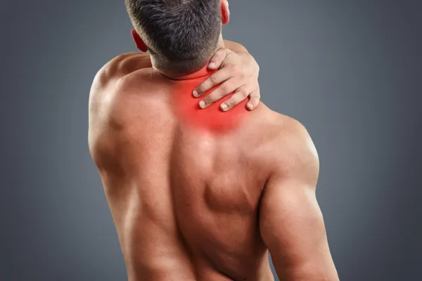 Tech neck massage in Bellevue room with soft lighting, ambient glow, and calming essential oils for stress relief.