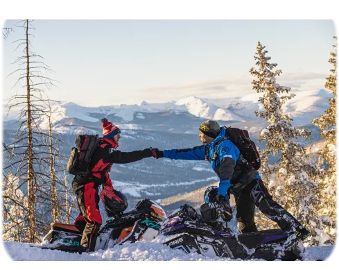 Custom black Polaris snowmobile with All Terrain Motorsports branding displayed in a showroom, alongside a graphic featuring the All Terrain Motorsports logo, Cole Willford 2five2 logo, and sponsor logos for Oxbow, Bikeman Performance, Skinz Protective Gear, Seco, and ArcticFX Graphics