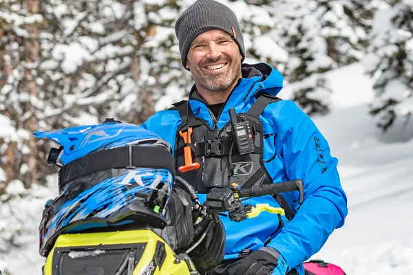 Cole Willford, professional snowmobiler, avalanche ready on his snowmobile