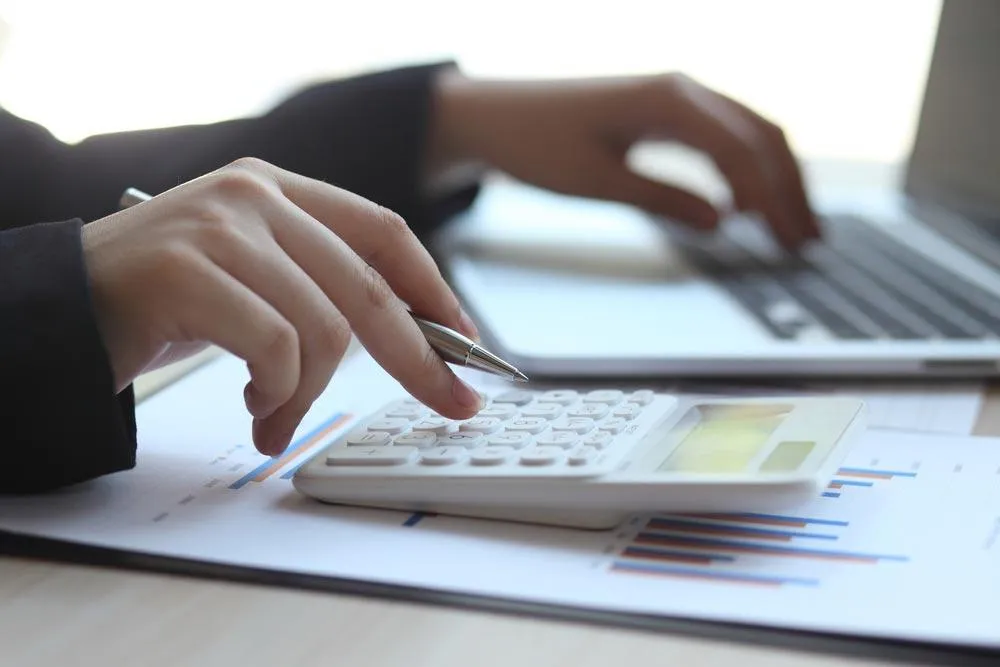 plastic surgeon doing bookkeeping