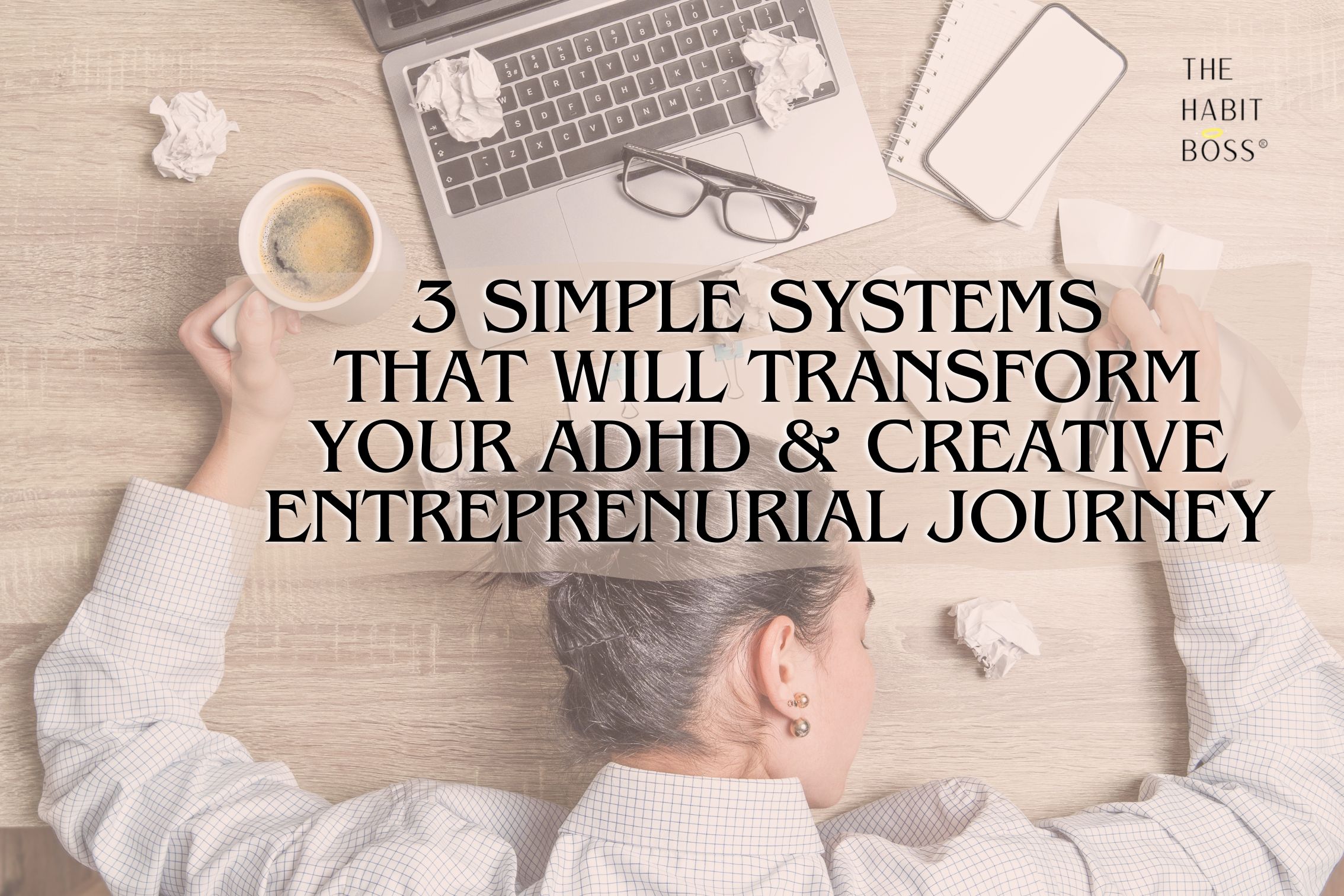 a woman slumped over her work desk with a coffee