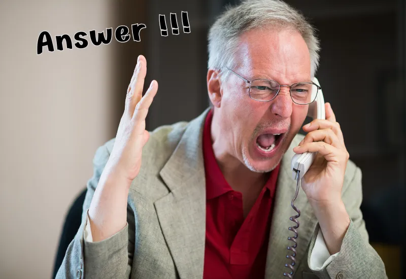 Stressed small business owner looking at missed calls on phone