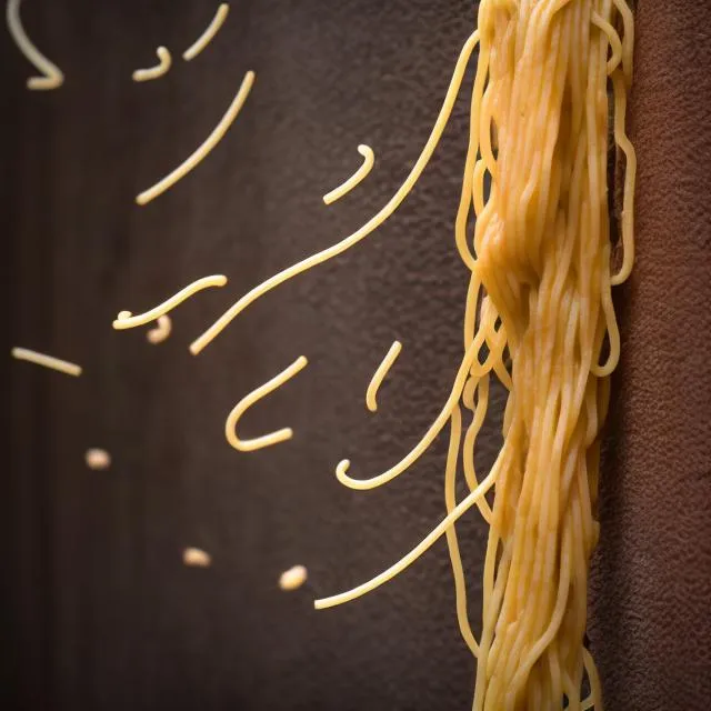 Spaghetti being thrown at a wall