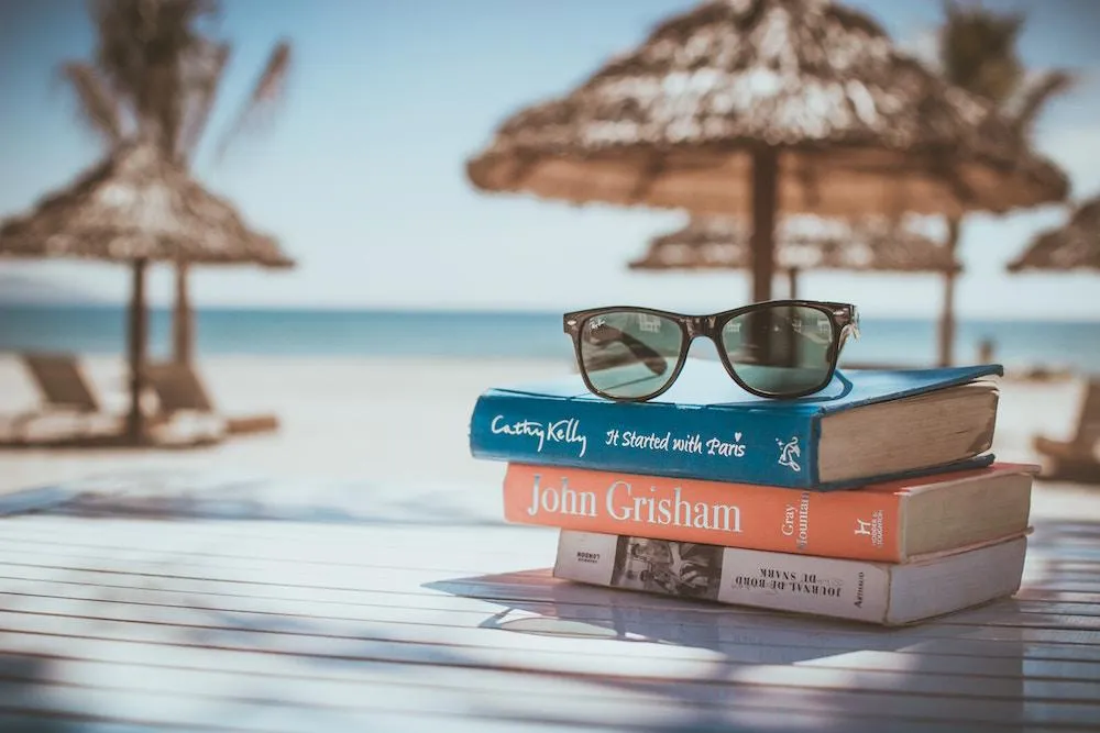 Attorney relaxing on a tropical beach, stress-free, while expert legal nurse consultants manage casework.