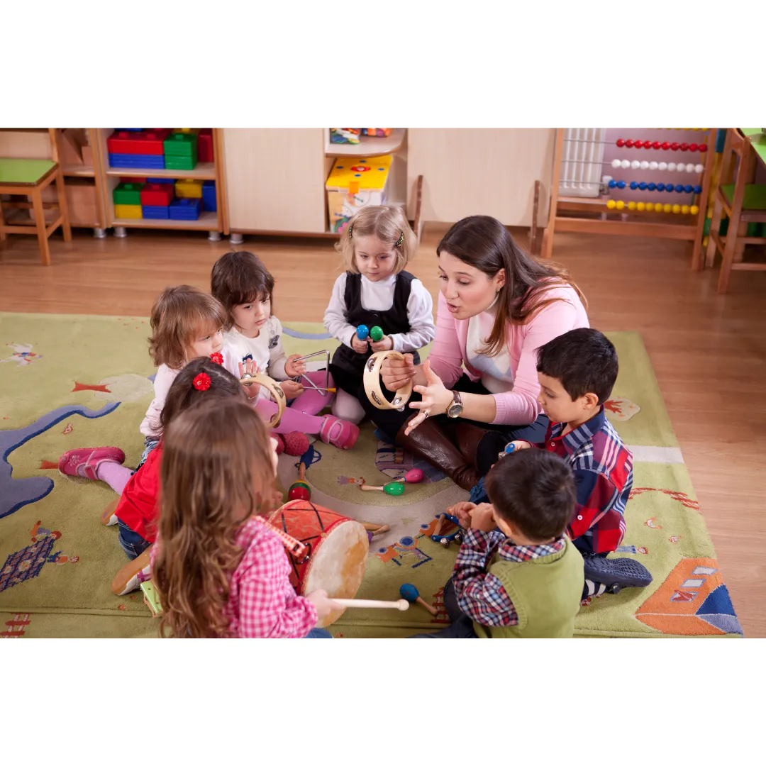 Happy 2-year-old participating in music time at an arts-based preschool.
