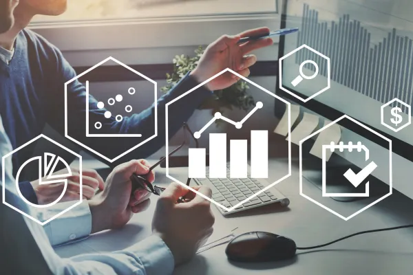 Financial advisors reviewing investment portfolio strategy with graphs and data icons representing diversification, risk management, and asset allocation.