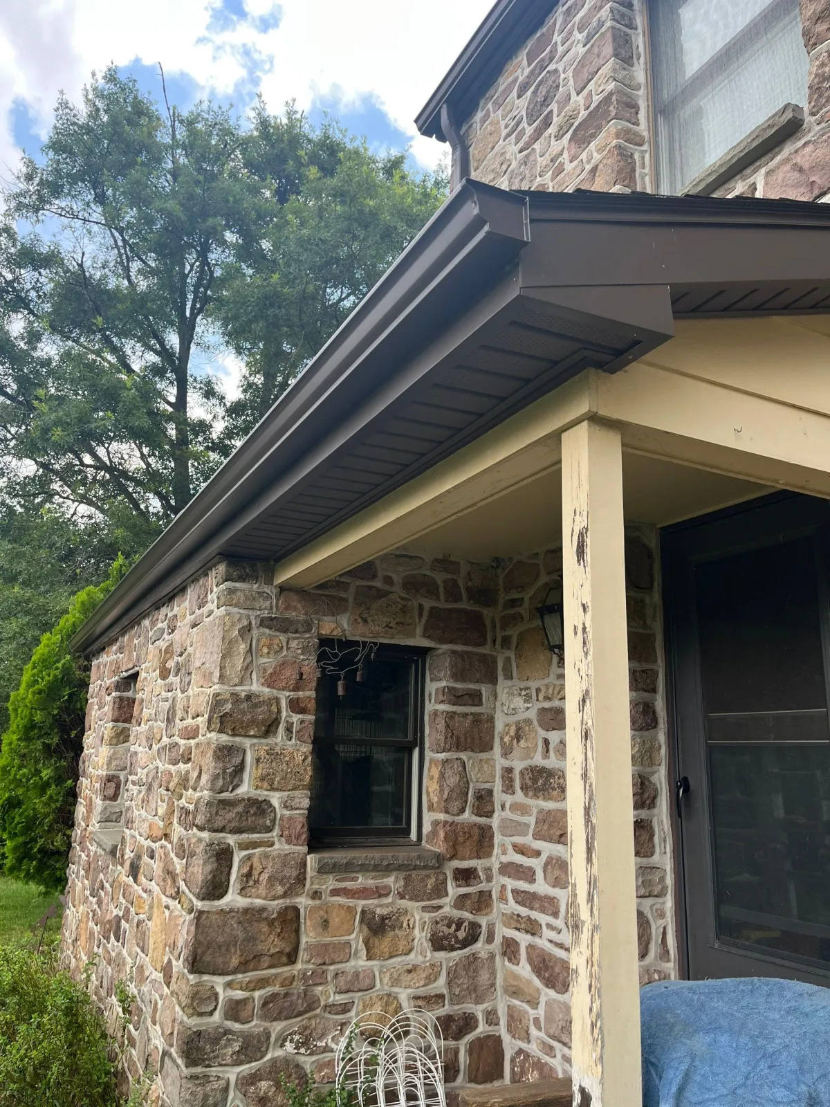 A new gutter system on the side of a house.