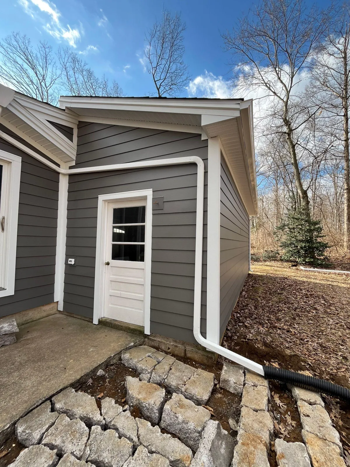 Exterior home siding, gutter, and trim installation.