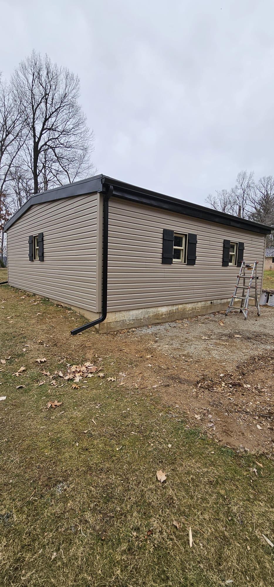 Vinyl siding and trim installation on a suburban home.