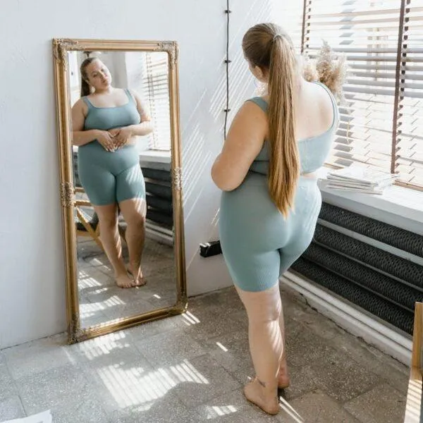 woman looking n mirror