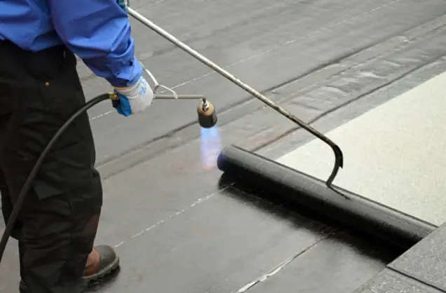 Modified bitumen flat roof with gravel surface on building in Arvada