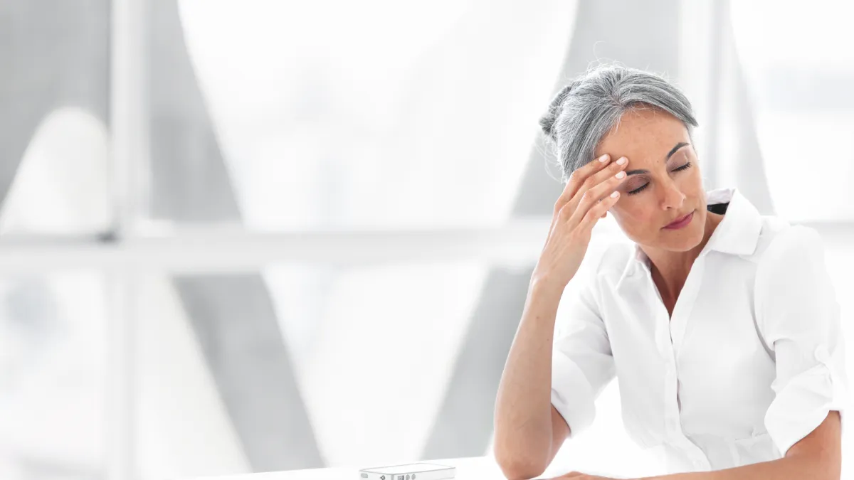 Tired woman at desk
