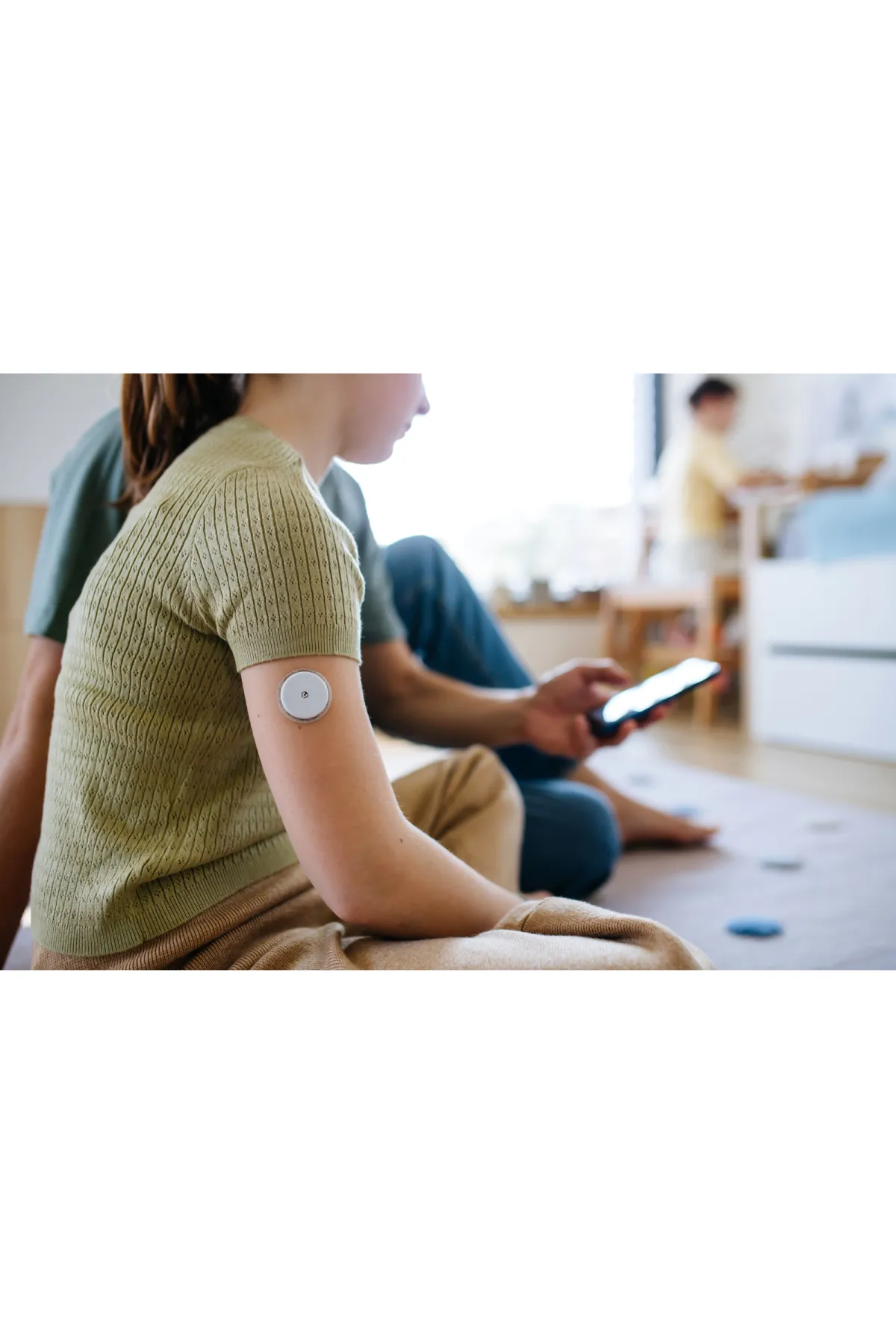 woman with cgm on arm