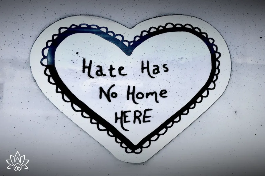 A person working at a laptop, symbolizing focus, resilience, and maintaining clarity amid external criticism and challenges