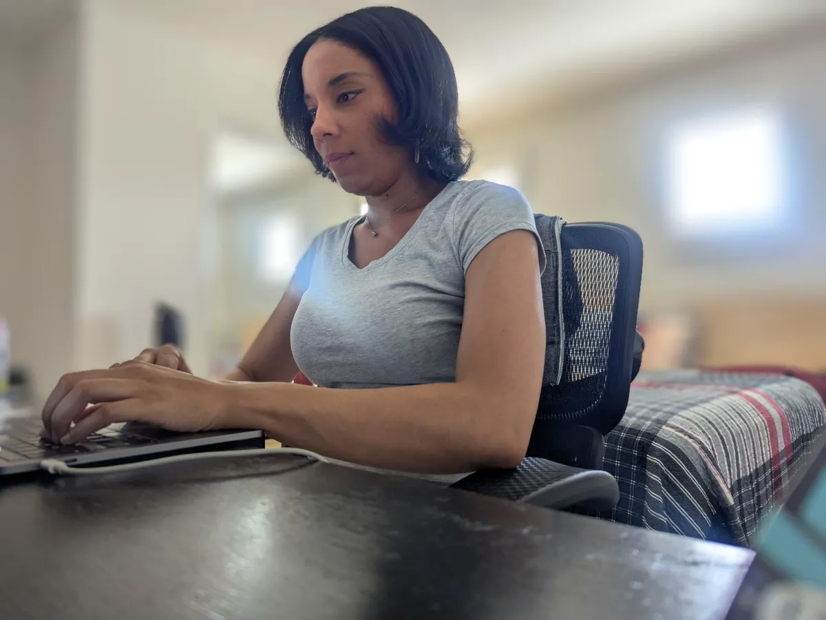 woman typing on computer