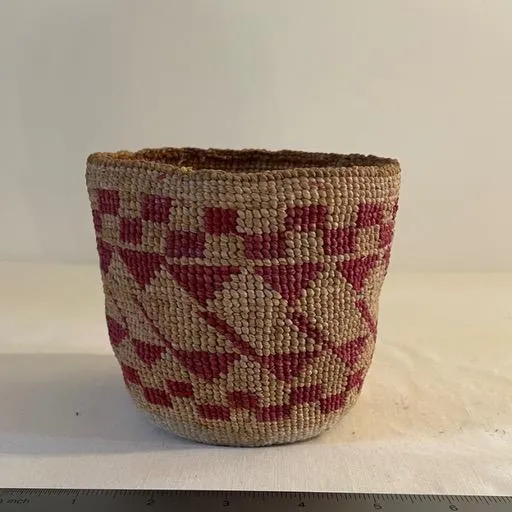 Close-up of an intricately woven Native American basket with vibrant patterns, featured in a blog about its history and craftsmanship.
