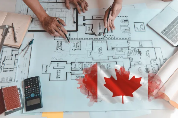 Cover image for a blog post titled 'Understanding Construction Costs in Canada.' The image features a construction site blueprint, tools like a hard hat, ruler, and calculator, with a subtle Canadian flag in the background. Text overlay reads the blog title in bold.