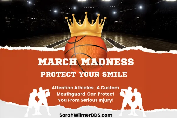 Basketball with a crown on a court, promoting mouthguard protection.