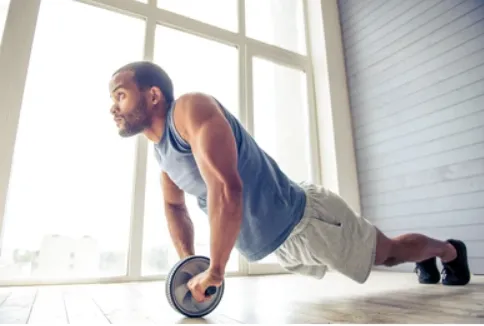 Middle aged dad doing an at home abs workout on the floor in his living room.