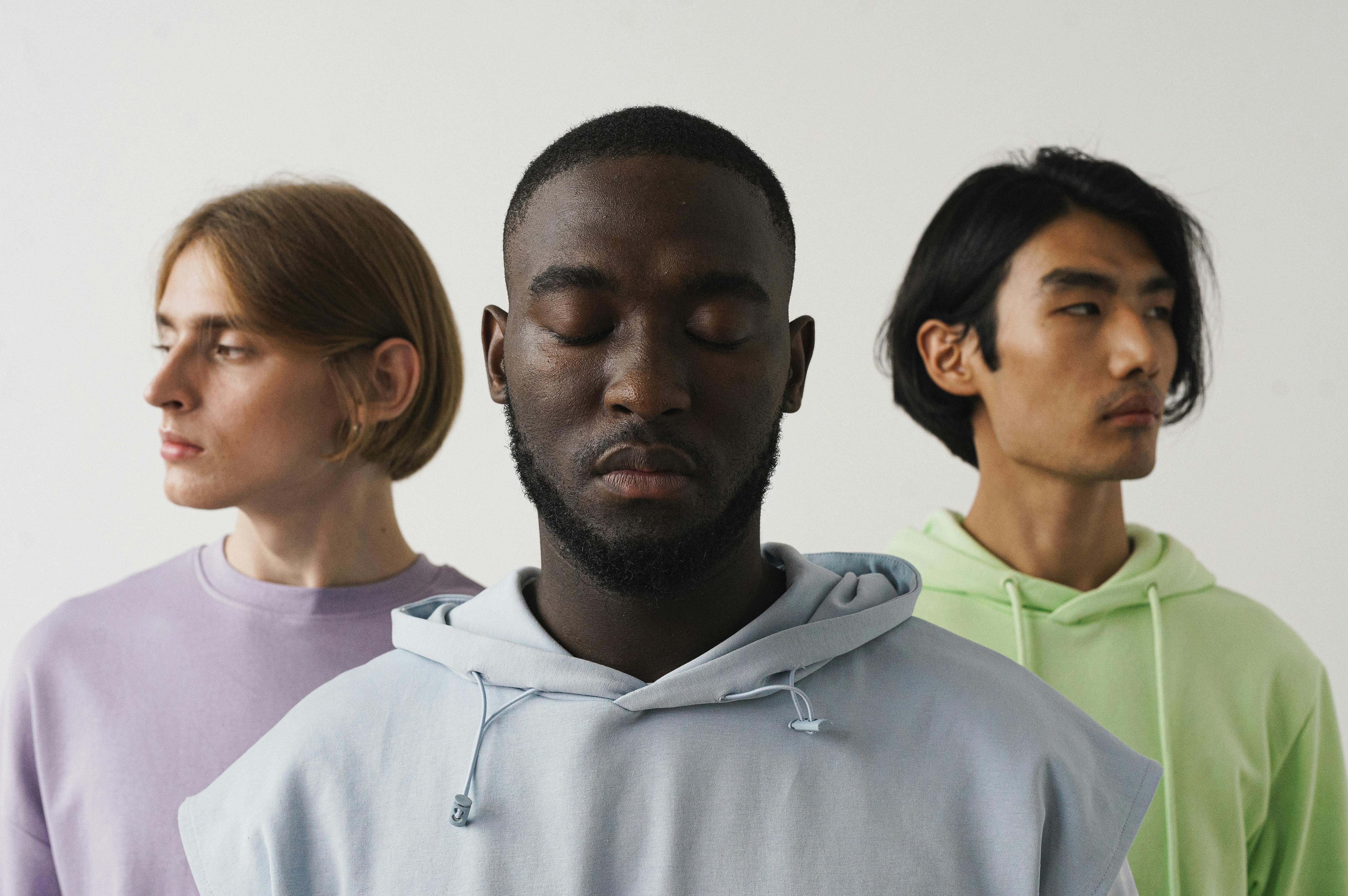 Diverse group of adults with eyes closed in a calm, reflective pose, representing mindfulness, emotional balance, and holistic wellness across different backgrounds.