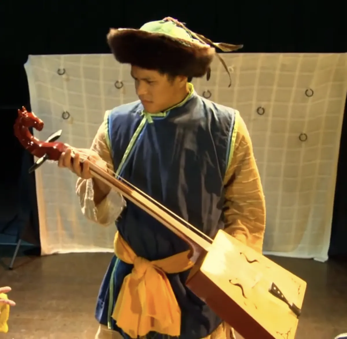 boy holding instrument