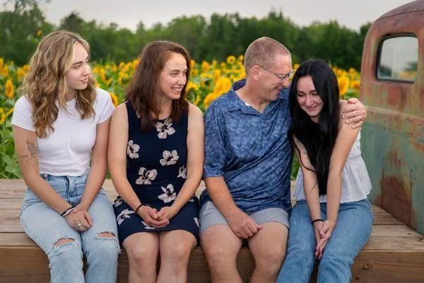 Happy family gathered together, reflecting the life-changing impact of daily 8-minute BEMER sessions on family wellness.