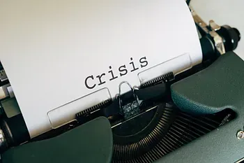 Printer showing the word "crisis"