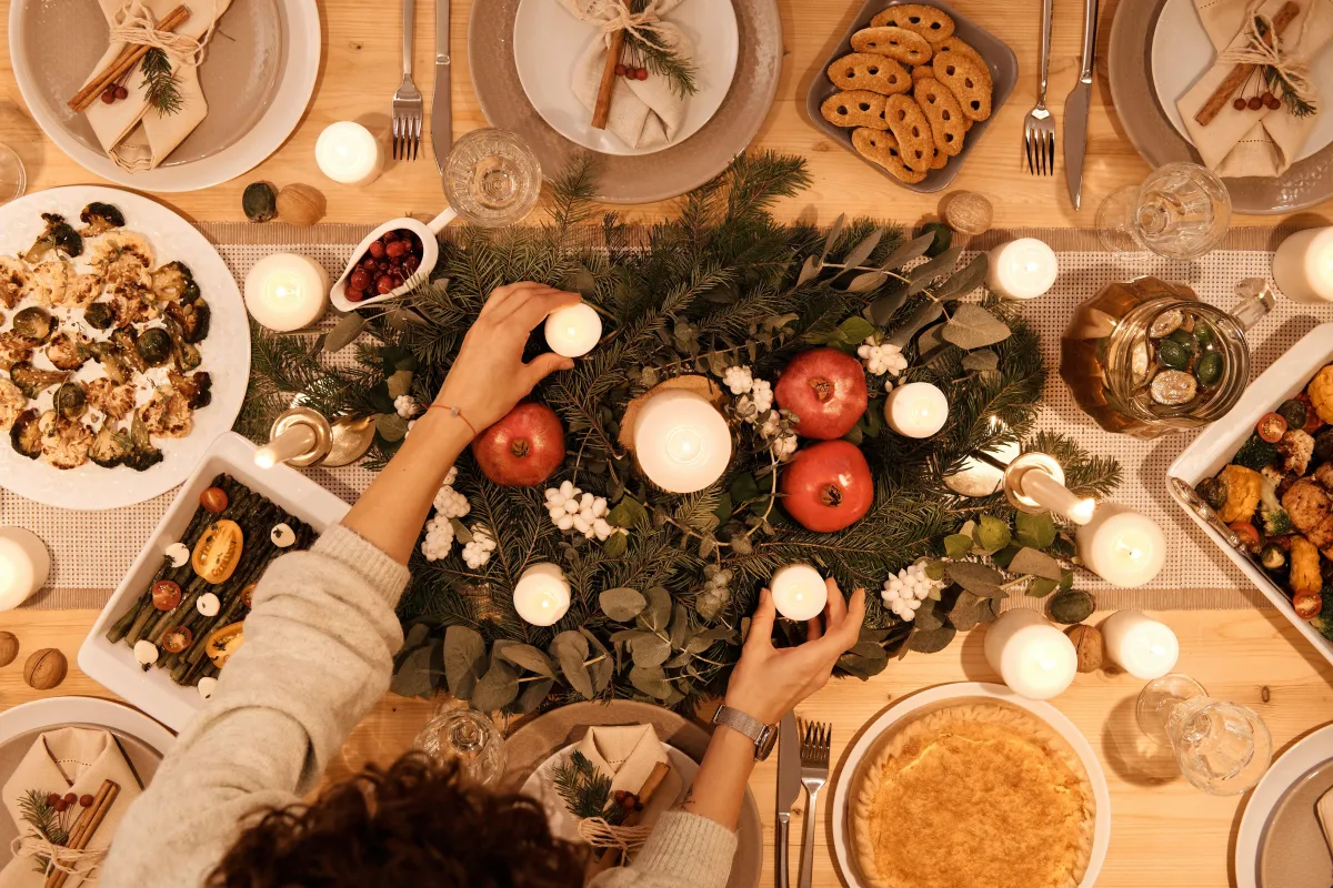 A table full of food with an extravagant center piece 