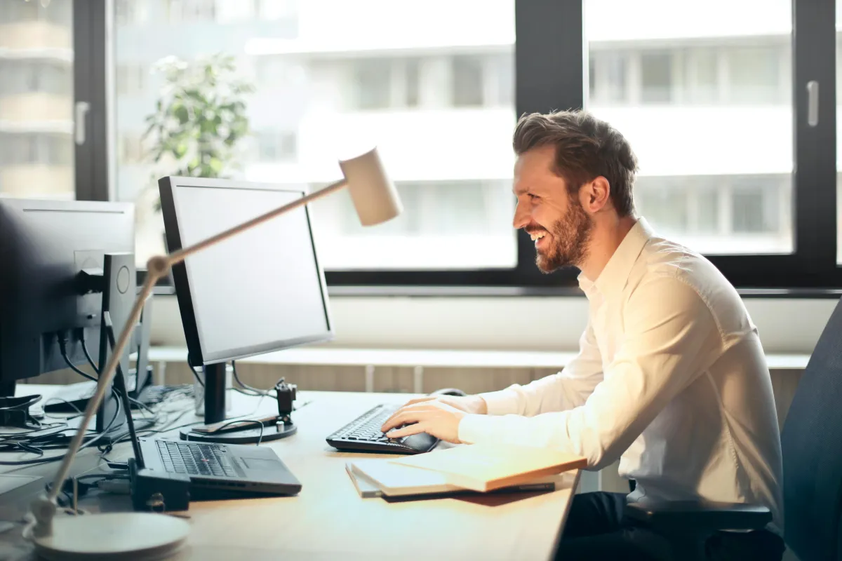 Financial Advisor sitting at desk working at computer