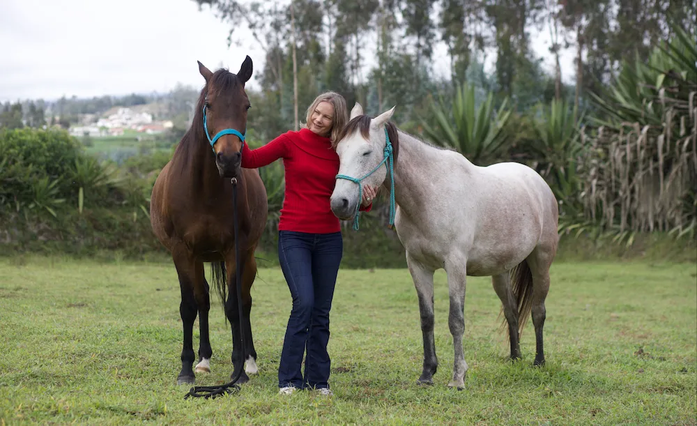 woman hugs horse