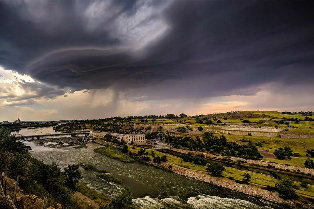 Storm clouds gather over the city skyline.