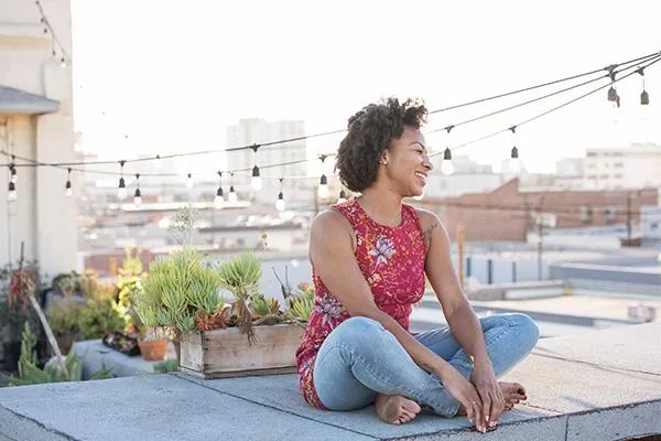 woman relaxing at the rooftop