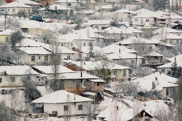 A village with roofs covered in snow