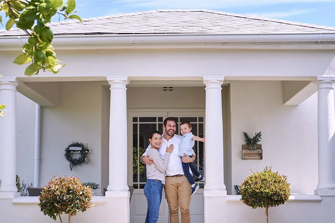A family enjoying their home with a freshly installed low-maintenance roof.