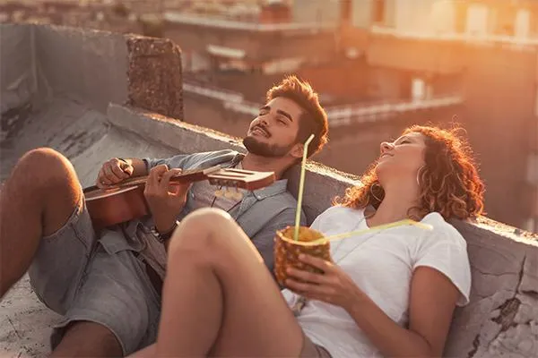 couple hanging out on the rooftop