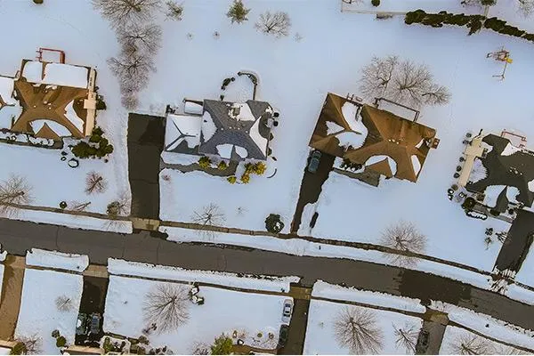 houses with snow on their roofs
