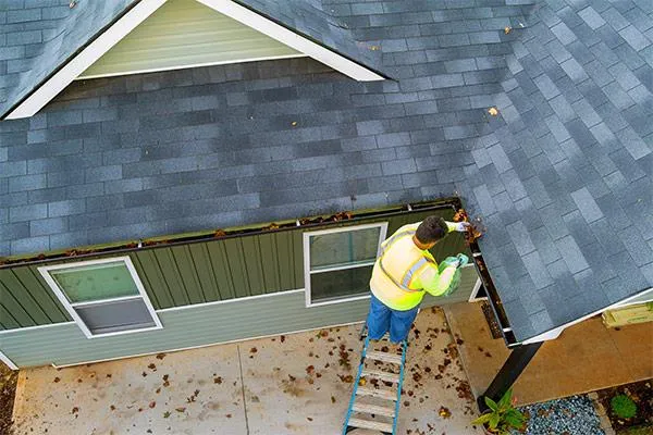 cleaning clogs in gutter