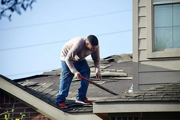 Roofer repairing a rooftop