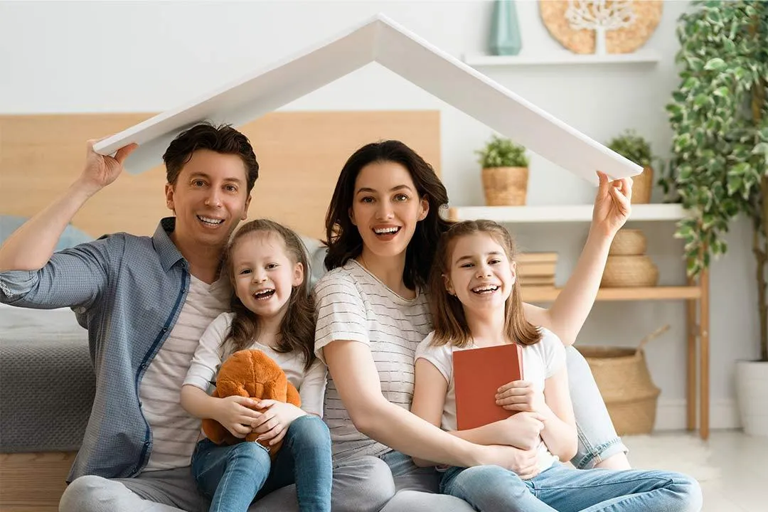 A family enjoying their home with a strong and secure roof over their heads.