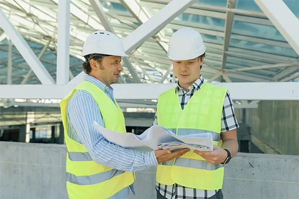 roofing contractors discussing roof installation plans
