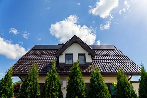 a roof painted in brown with installed solar panels