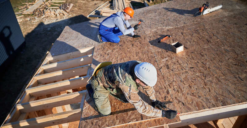 workers install roofs, laying shingles for sturdy structures