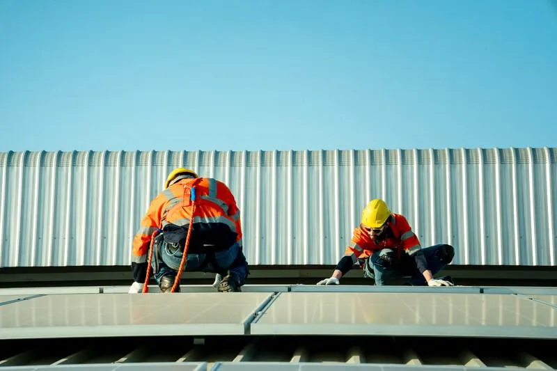 workers install commercial roofing for durability and protection