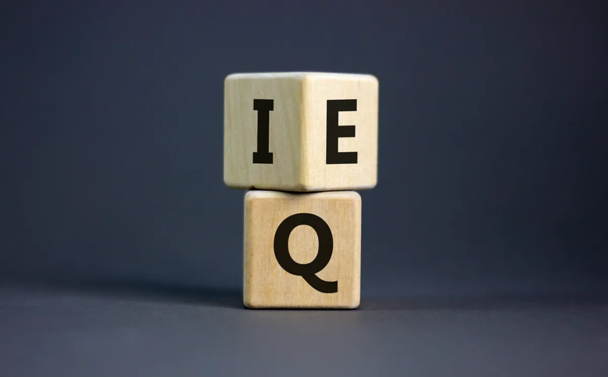 EQ and IQ blocks symbolizing emotional intelligence and leadership balance