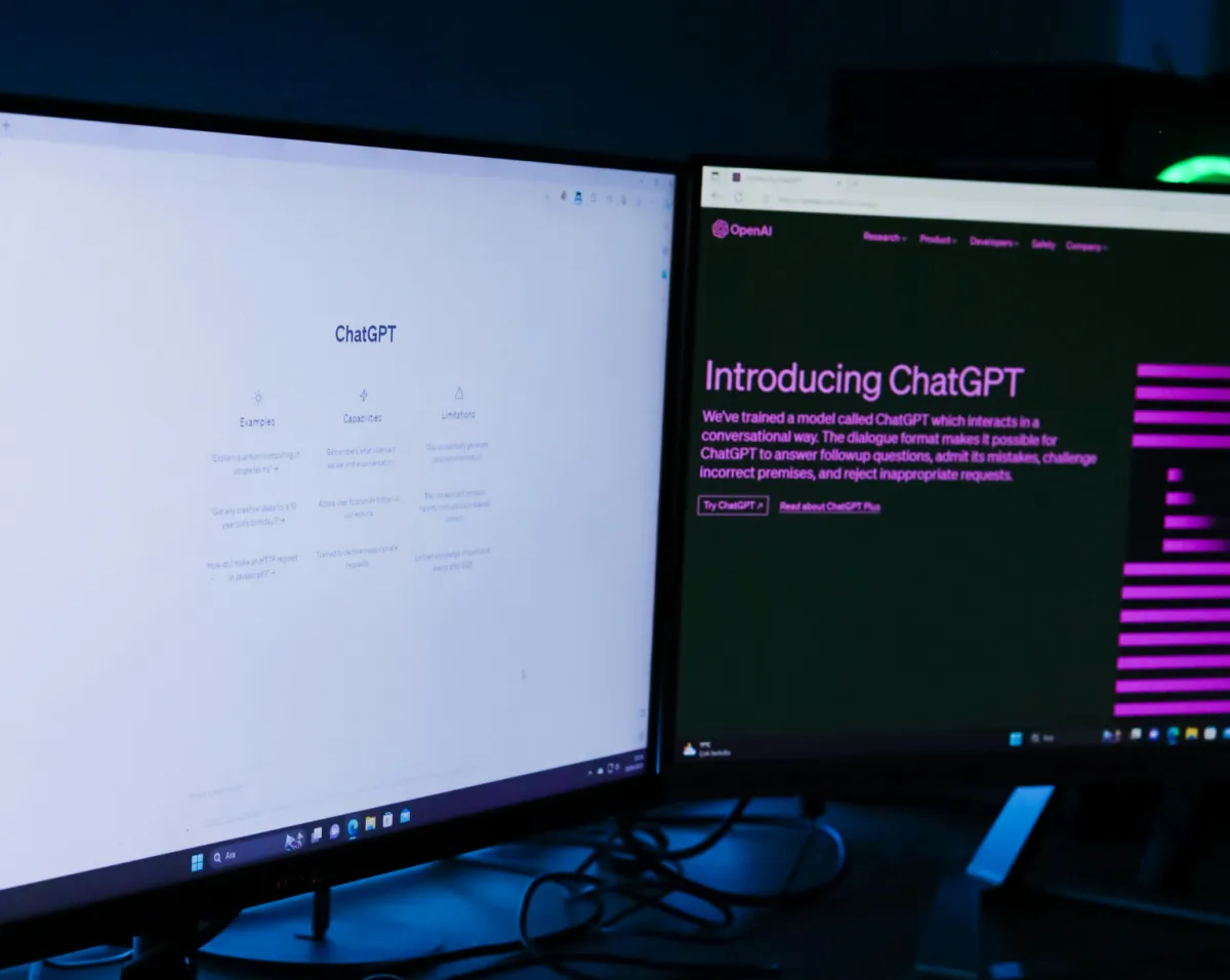 Dual monitors displaying ChatGPT Agent interface and launch page, illustrating enterprise adoption of ChatGPT Agent for business productivity