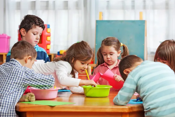 A picture of children engaged in playful activities, or a well-organized play area.