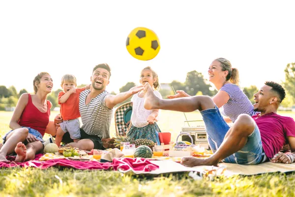 A picture of a joyful outdoor picnic, or a person enjoying a scenic outdoor setting.