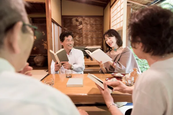 A picture of a lively book club meeting or a person enjoying a literary event.
