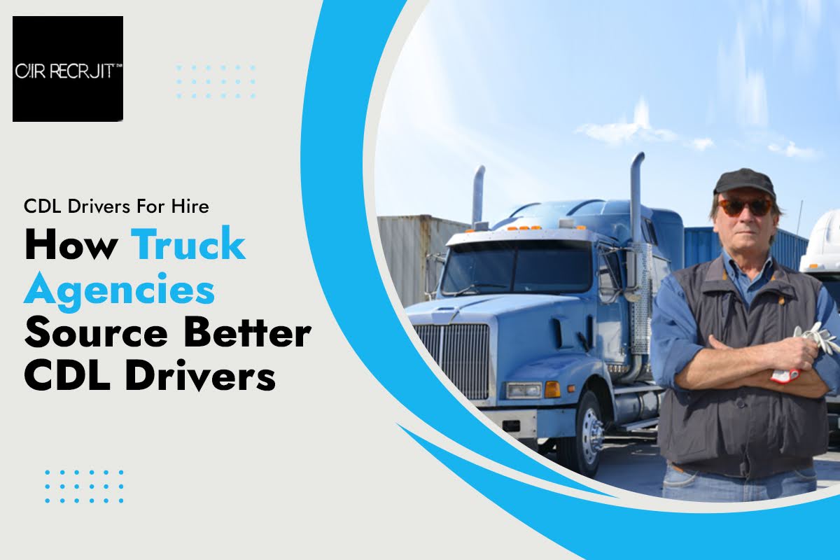 Truck driver posing in front of a fleet of trucks