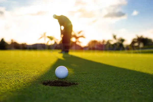 Golf ball rolling in the hole with Hansel Duran across the image palm aire florida in pompano beach